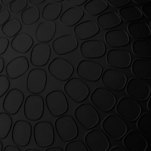 Close-up of a black abstract textured pattern with oval shapes.