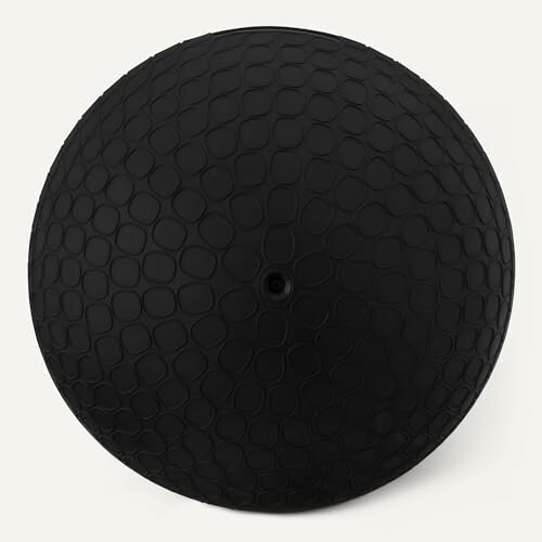 Black textured fitness ball with a geometric pattern.