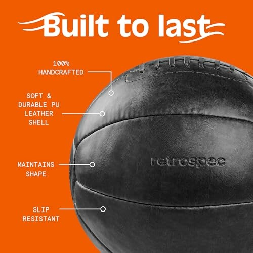 Black handcrafted medicine ball with durability features on orange background.