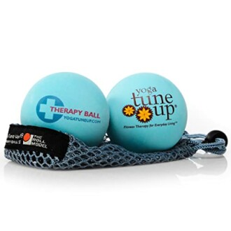 Two blue therapy balls with Yoga Tune Up branding in a mesh bag.